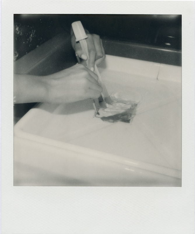 Photo: Justin Goode - A student separates emulsion from integral film